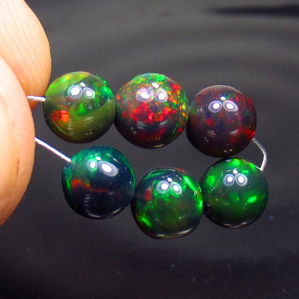 5.45 Ct Natural 6 Drilled Black Fire Opal Ball Beads: No Reserve! Title: 5.45 Ct Natural 6 Drilled Black Fire Opal Ball Beads Stone Clarity: Translucent Gemstones: Natural Black Opal Beads Carat Weights: 5.45 Size/Dimensions: 5.60 to 6.00 mm / 6 PC's Add