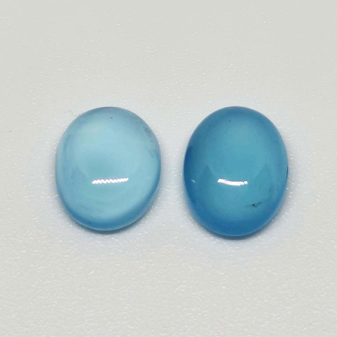 3.75 ct Natural Blue Chalcedony Pair: No Reserve! Title: 3.75 ct Natural Blue Chalcedony Pair Additional Information: Gemstones: Chalcedony Carat Weights: 3.75 ct Size/Dimensions: 8.7 x 6.7 x 3.5 mm Origin : India Materials: Chalcedony We