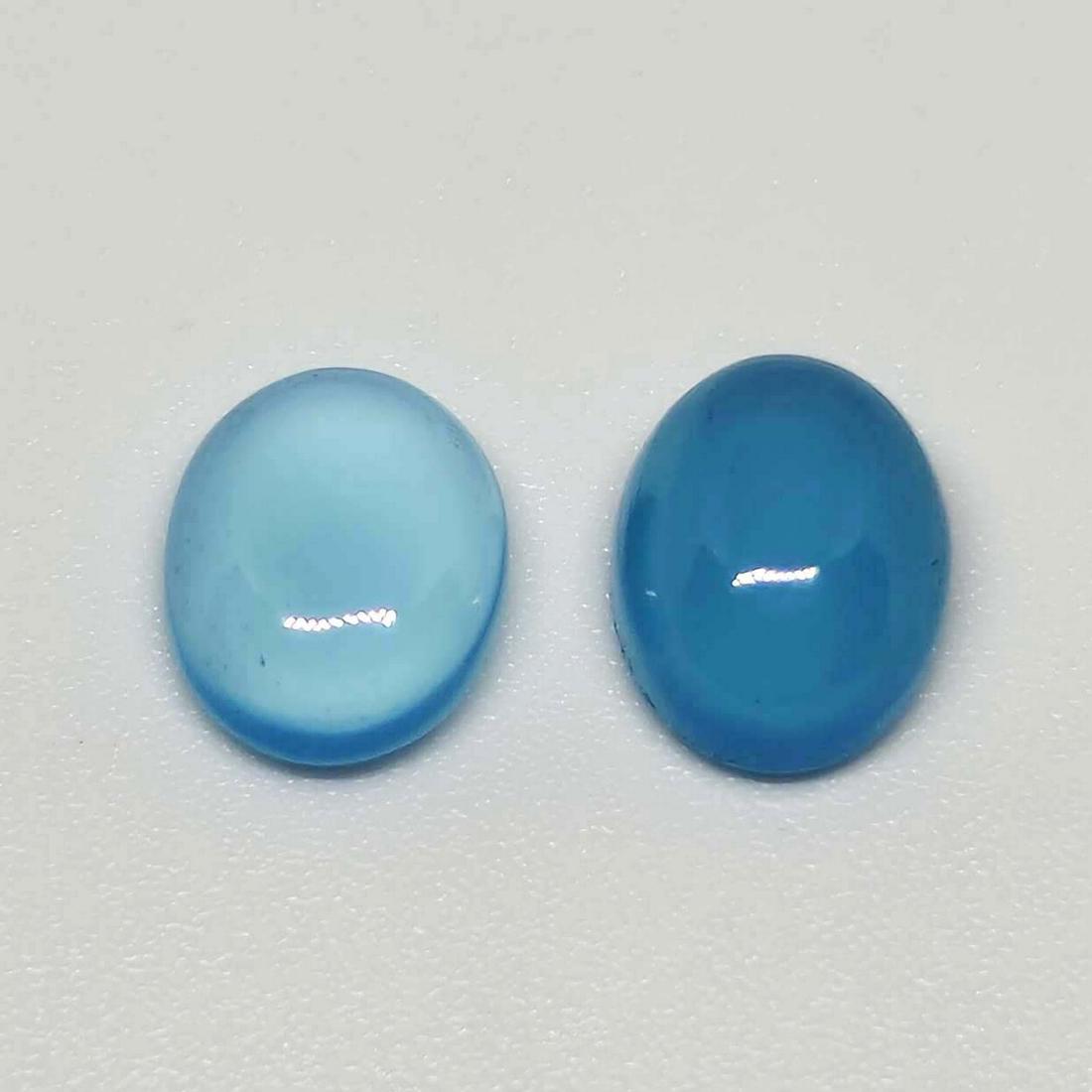 4.25 ct Natural Blue Chalcedony Pair: No Reserve! Title: 4.25 ct Natural Blue Chalcedony Pair Additional Information: Gemstones: Chalcedony Carat Weights: 4.25 ct Size/Dimensions: 8.7 x 6.7 x 3.5 mm Origin : India Materials: Chalcedony We