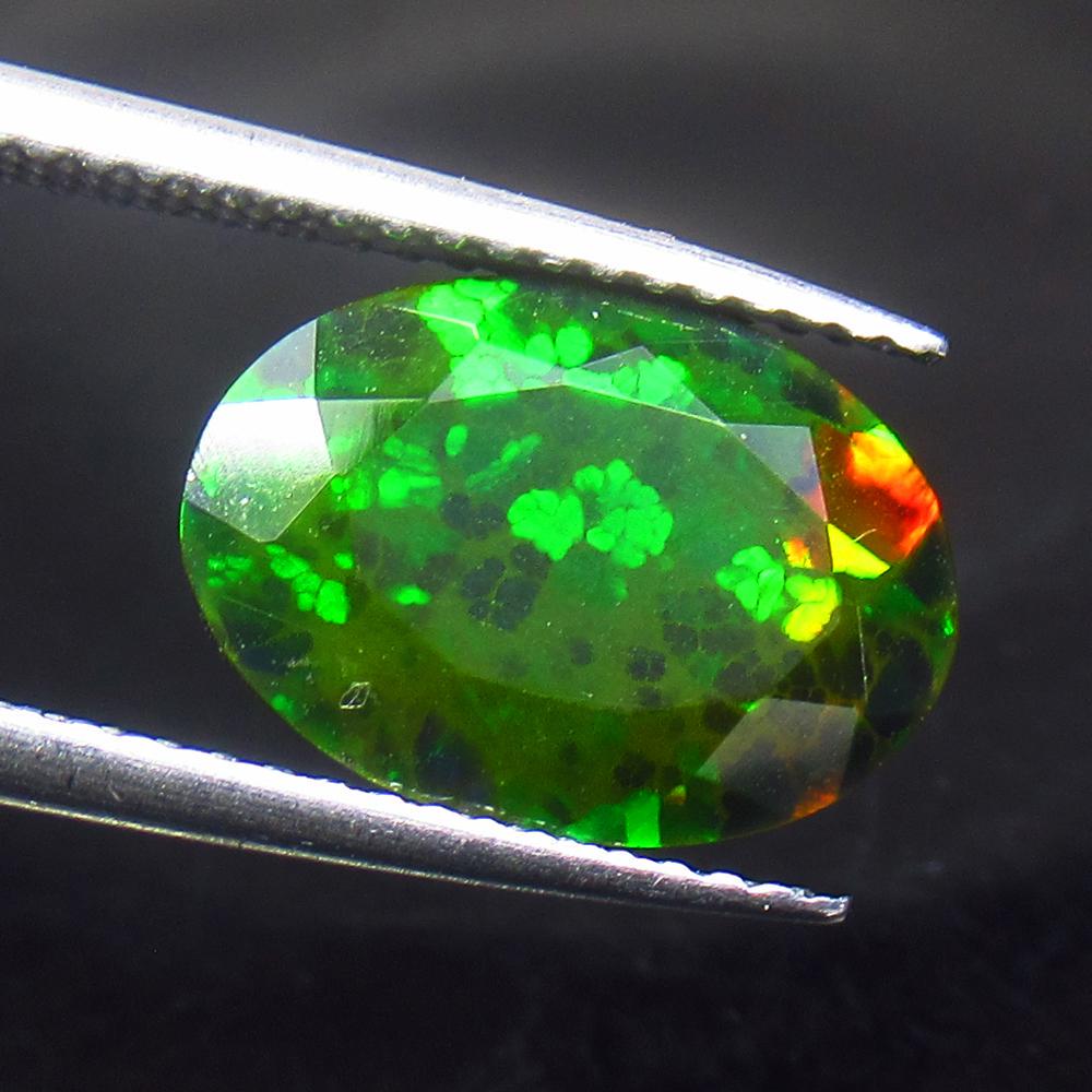 2.91 Ct Natural Black Fire Opal: Title: 2.91 Ct Natural Black Fire Opal Stone Clarity: Translucent Gemstones: Natural Opal Carat Weights: 2.91 Size/Dimensions: 12.60 x 9.00 x 6.20 mm Additional Information: Shape - Oval Cut / Color -
