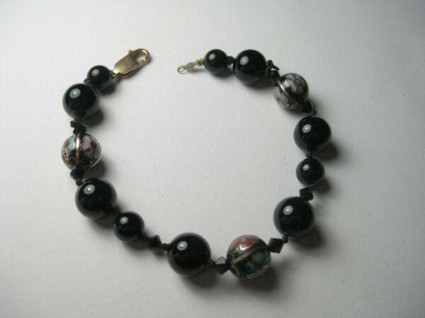 Vintage Round Black Cloisonne & Onyx or Glass Beaded: Vintage unsigned 7.5" bracelet made up of black 1/2" round beads and 1/4" black beads with three beautiful cloisonne floral beads - do not know if the gold in the cloisonne beads is real or just goldt