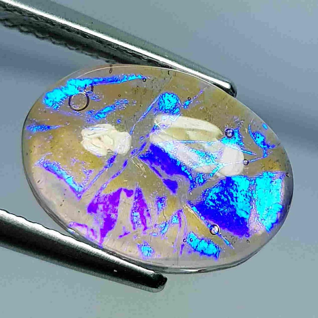 5.61 ct Australian Doublet Opal: No Reserve! Title: 5.61 ct Australian Doublet Opal Color/Clarity: Opaque Loosegemstone Carat Weights: 5.61 Size/Dimensions: 14.00 x 10.00 x 5.40 Additional Information: Oval - Australia Shipping: Dome