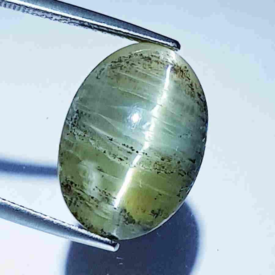 14.35 ct Natural Opal Cat's Eye: No Reserve! Title: 14.35 ct Natural Opal Cat's Eye Color/Clarity: Semi Transparent Loosegemstone Carat Weights: 14.35 Size/Dimensions: 18.00 x 12.80 x 10.70 Additional Information: Oval - Africa Shipp