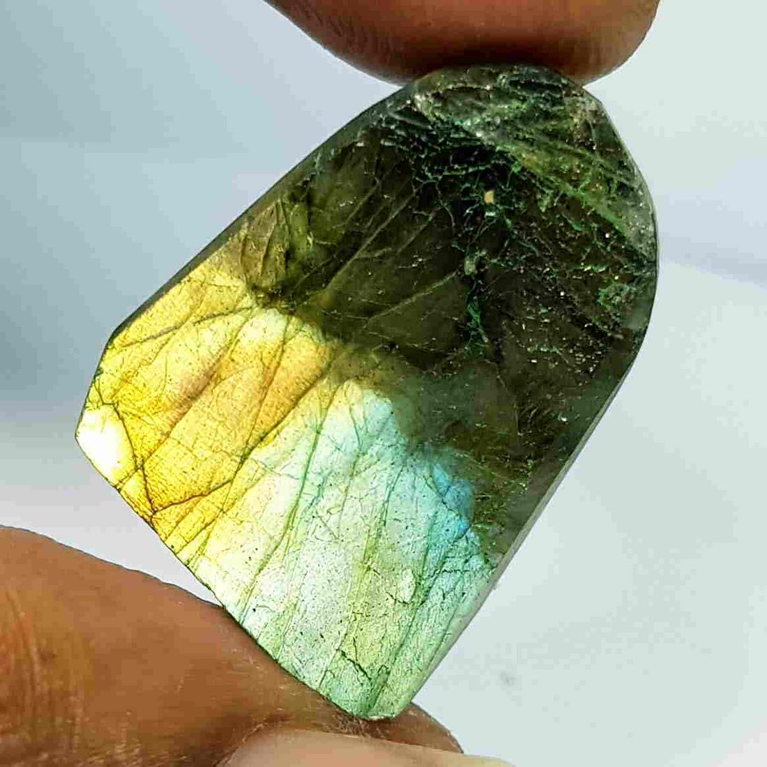27.10 Ct Natural Labradorite Slice: No Reserve! Title: 27.10 Ct Natural Labradorite Slice Color/Clarity: Opaque Loosegemstone Carat Weights: 27.1 Size/Dimensions: 24.30 x 19.20 x 5.80 Additional Information: Fancy - USA Shipping: Domest