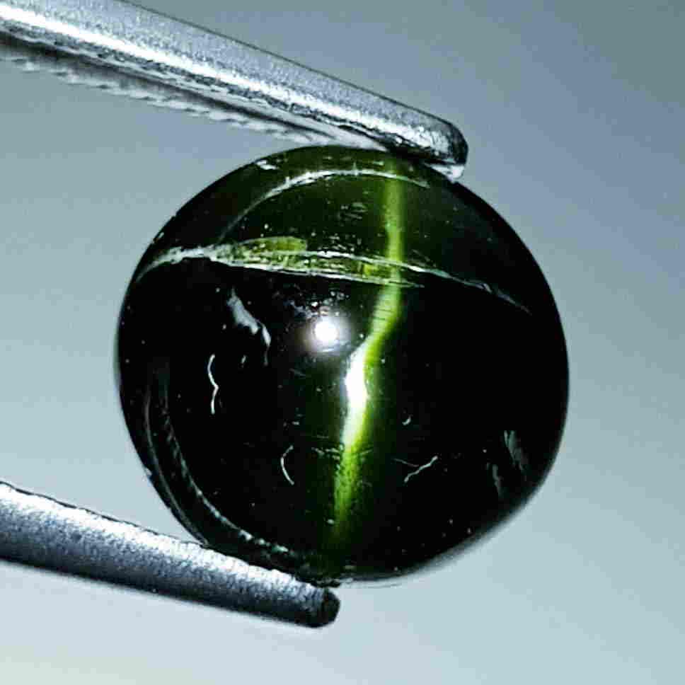 Natural Kornerupine Cat's Eye - 3.49 ct: No Reserve! Title: Natural Kornerupine Cat's Eye - 3.49 ct Color/Clarity: Opaque Loosegemstone Carat Weights: 3.49 Size/Dimensions: 8.70 x 8.50 x 5.10 Additional Information: Round - Madagascar Shippi