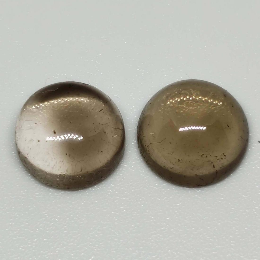 5.70 ct Natural Smoky Quartz Pair: No Reserve! Gemstones: Smoky Quartz Carat Weights: 5.70 ct Size/Dimensions: 9 x 9 x 5 mm Origin : Scotland Shipping: Domestic: Flat-rate of $7.00 to anywhere within the contiguous U.S. International: 