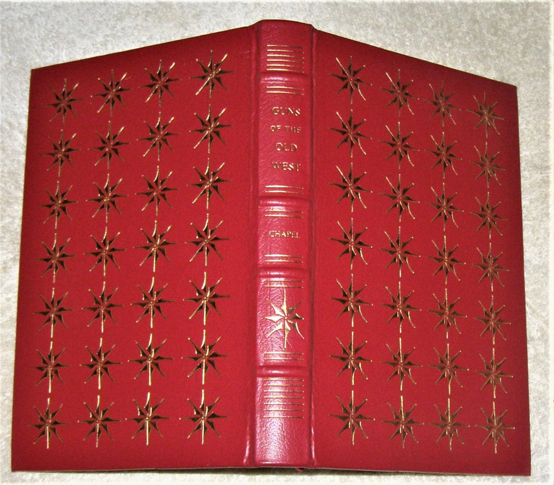 GUNS OF THE OLD WEST by Charles Edward Chapel: A Special edition bound in full red leather with 22K Gold tooling and edges. 1995 reprint of classic firearms history of the American West from Kentucky to Teddy Roosevelts Guns. Deringers, Revolvers,