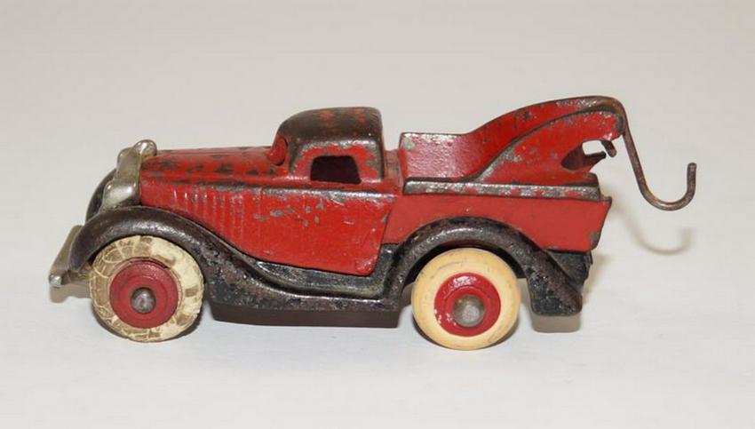 Antique Terraplane Wrecker Tow Truck Hubley Toy: Title: Antique Terraplane Wrecker Tow Truck Hubley Toy Date/Period: Ca. 1930's. Dimensions: 1 1/4" tall x 3 3/4" long x 1 1/2" wide. Provenance/Additional Info: Offering for sale a terraplane wrecker 