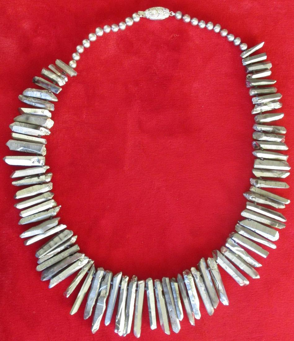 Silver Quartz Dagger Bead Necklace: Graduated Natural Silver Fumed Quartz Nugget Dagger Bead Necklace Circa. 1980's American This is new/old stock. We have re-strung this 18-inch necklace with individual knots between each bead. Matchin