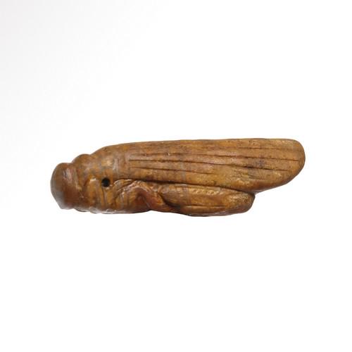 Egyptian Yellow Stone Grasshopper Amulet, Late Period,: Title: Egyptian Yellow Stone Grasshopper Amulet, Late Period, c. 2nd-1st Century B.C. Date & Origin: Egyptian, c. 2nd-1st Century B.C. Description: With plain wings, the body very finely and delicatel