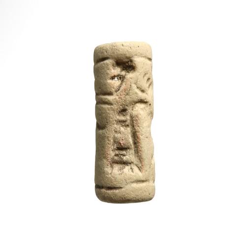Assyrian Cylinder Seal of Faience, Archer & Animal,: Title: Assyrian Cylinder Seal of Faience, Archer & Animal, Lambert Paper Date & Origin: Near East, c. 800 - 400 B.C. Description: The design, which is put between upper and lower rulings, shows a stan