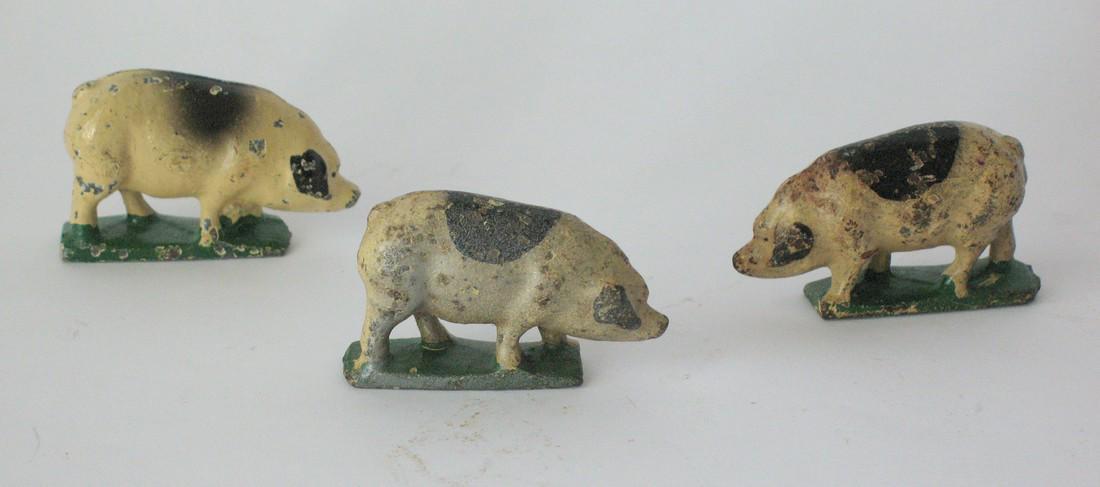 Group of vintage cast iron pigs figures. (1 of 3)