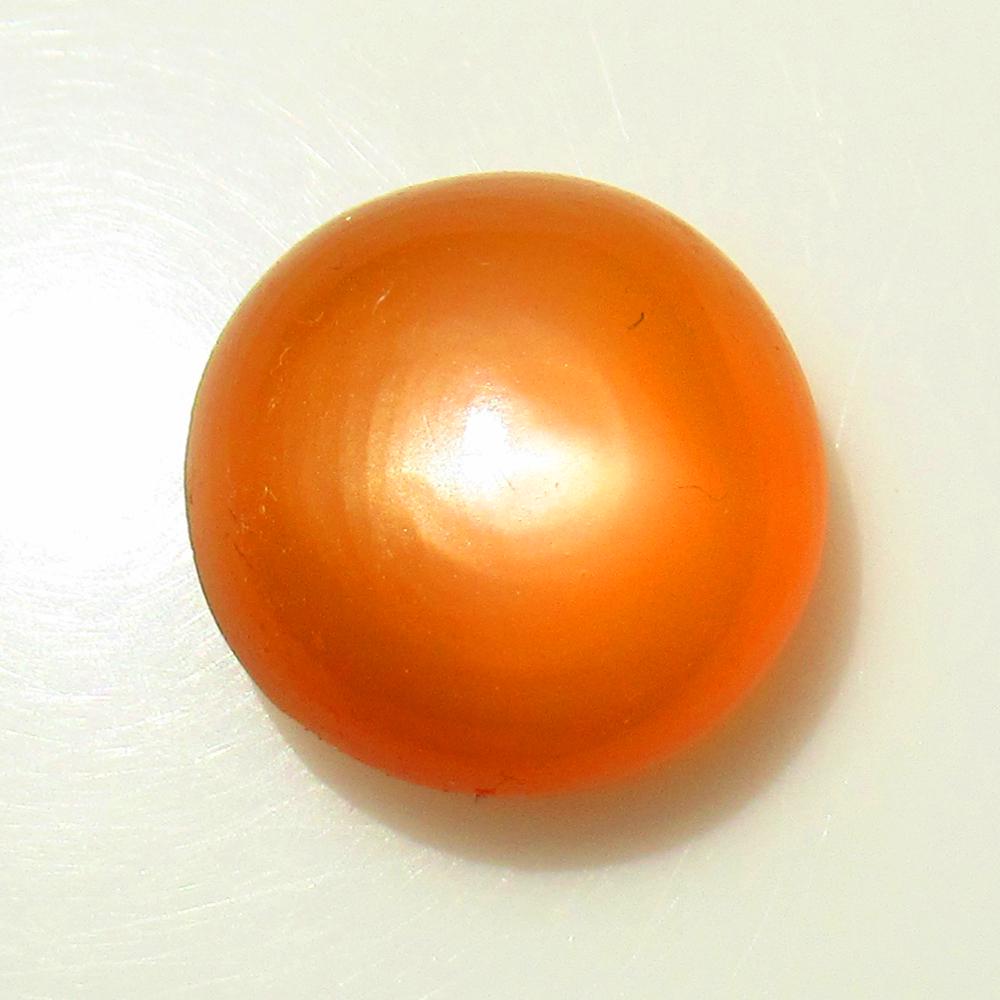 15.66 Ctw Natural Orange Moonstone Round Cab: Title: 15.66 Ctw Natural Orange Moonstone Round Cab Stone Clarity: Semi-Transparent Gemstones: Moonstone Carat Weights: 15.66 Size/Dimensions: 15.30 x 15.00 x 9.40 mm Additional Information: Nice Roun