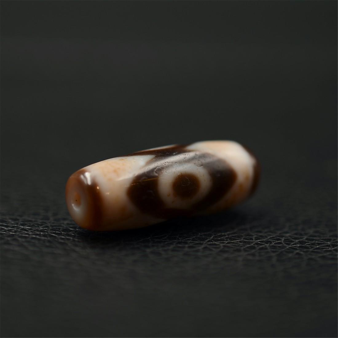 Tibetan three-eye dzi bead (1 of 4)