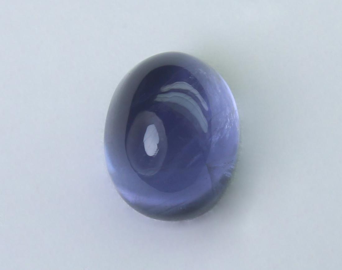 1.68 Cts Natural Iolite: No Reserve! Gemstone: Natural Iolite Origin: Nepal Weight: 1.68 Carats Measurements: 10.53x7.57x3.57 mm Shape / Cut: Paer Cabochan Colour: Blue Transparency: transparent Clarity: No visible inclusion