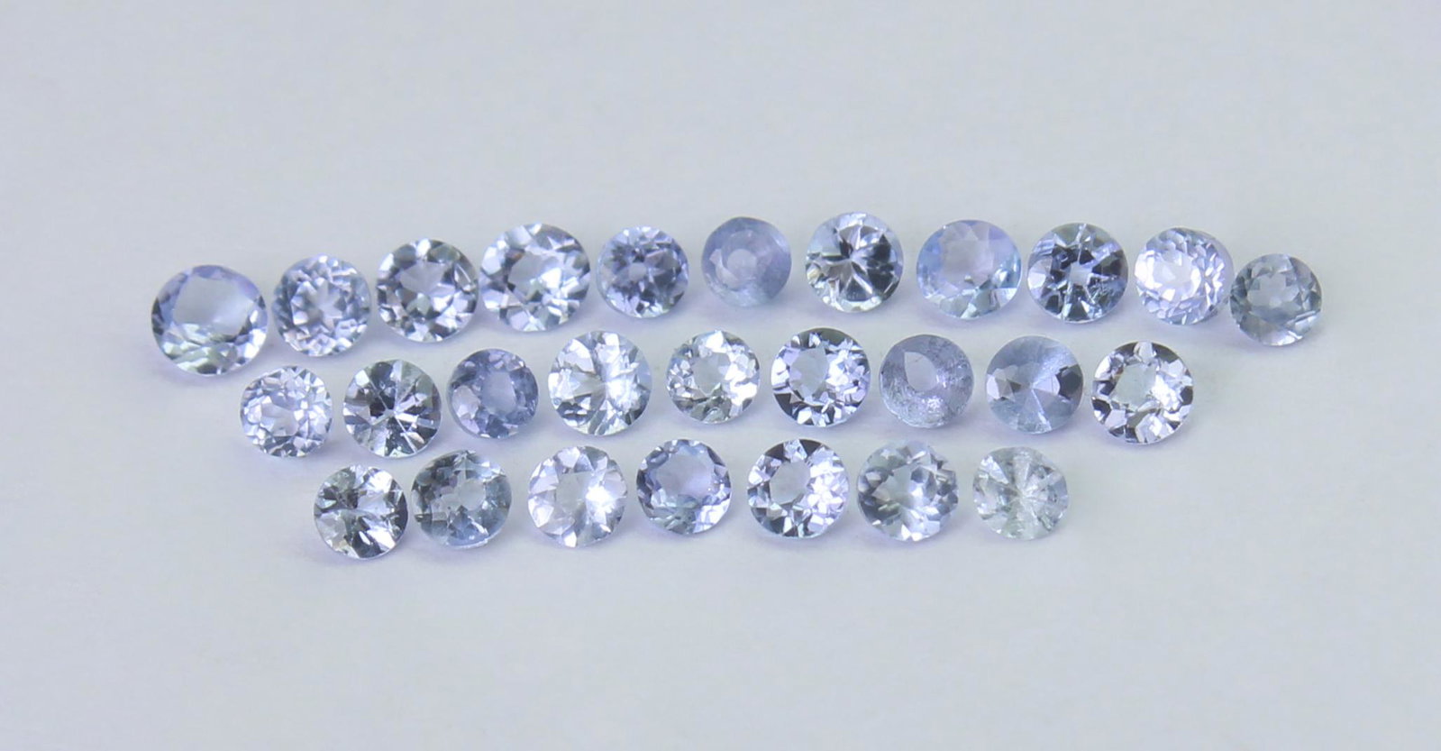 0.97 Cts Natural Tanzanite Lot: No Reserve! Gemstone : Natural Tanzanite Shape and cut : Round Cut Weight : 0.97 Carats Measurements : 2x2 mm Number Of Stone : 27 Color : voilite Transprancy : Transparent Treatment : No Treatment Or