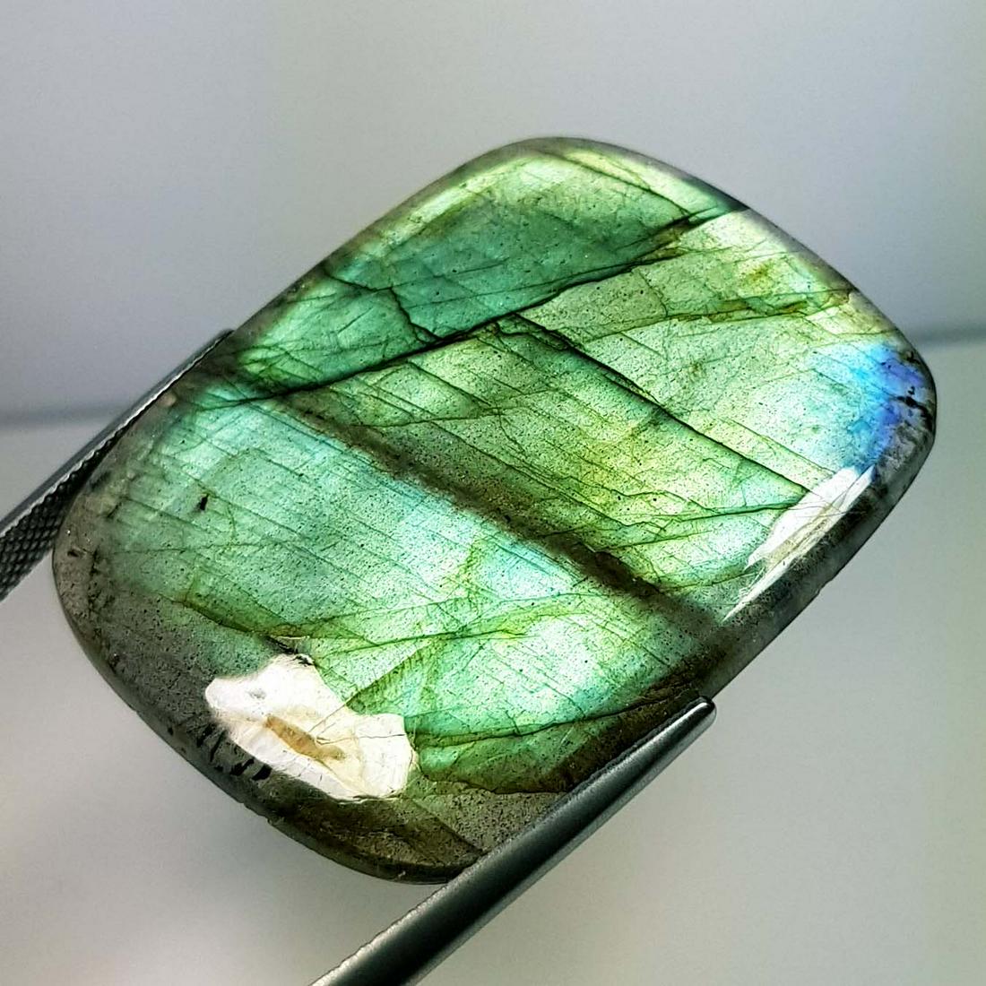 71.95 ct Natural Labradorite: No Reserve! Title: 71.95 ct Natural Labradorite Color/Clarity: Opaque Carat Weight: 71.95 Dimensions: 41.05 x 32.85 x 5.45 Additional Information: Rectangular - USA Shipping: Domestic: Flat-rate of $