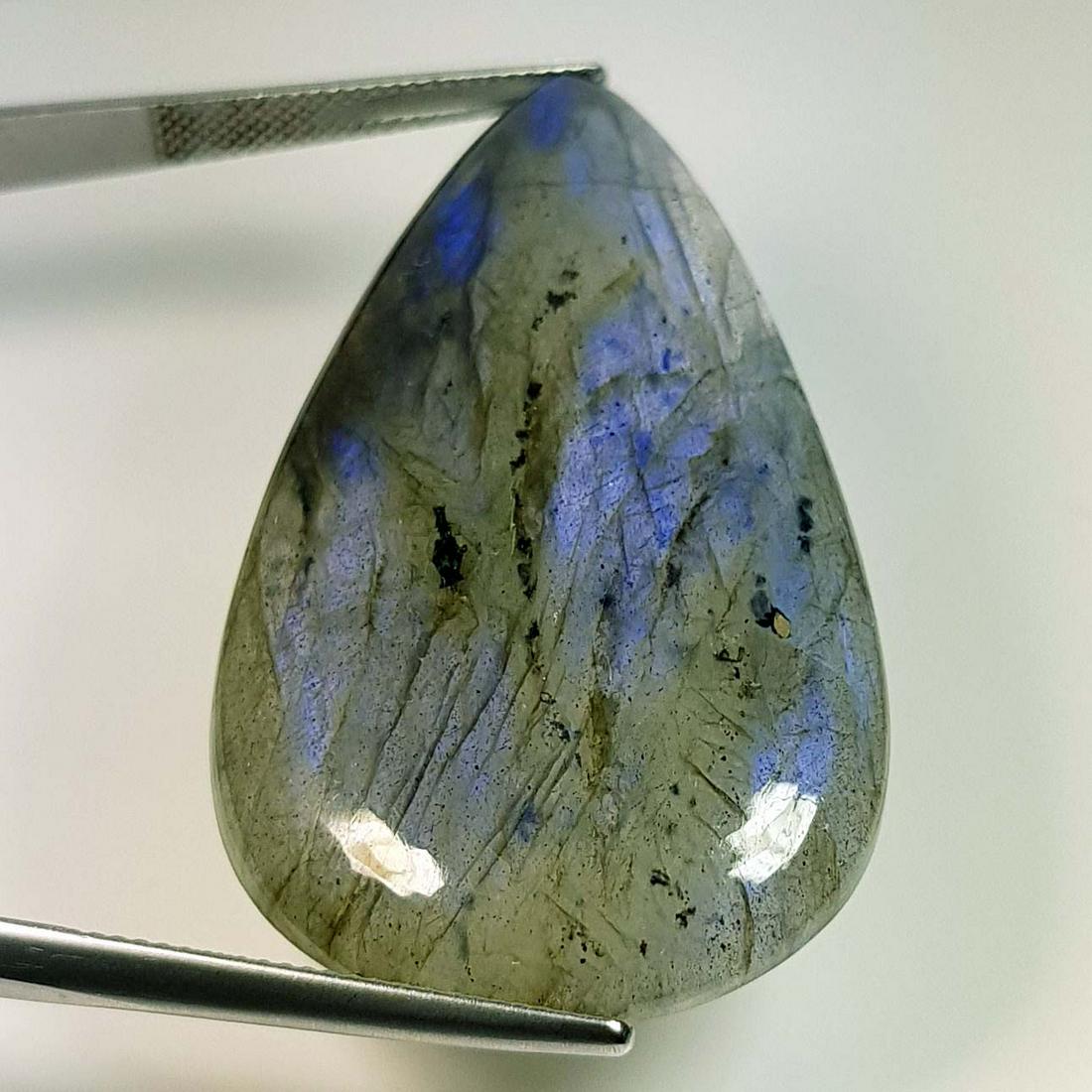 60.88 ct Natural Labradorite: No Reserve! Title: 60.88 ct Natural Labradorite Color/Clarity: Opaque Carat Weight: 60.88 Dimensions: 48.10 x 27.80 x 5.80 Additional Information: Pear - USA Shipping: Domestic: Flat-rate of $7.00 to