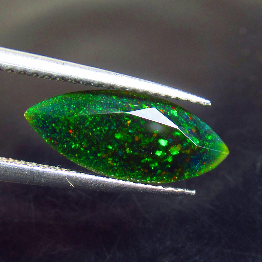 1.73 Ct Natural Ethiopian Black Fire Opal Marquise Cut: No Reserve! Title: 1.73 Ct Natural Ethiopian Black Fire Opal Marquise Cut Stone Clarity: Opaque Gemstone: Natural Black Opal Carat Weights: 1.73 Size/Dimensions: 16.30 x 6.70 x 4.40 mm Additional Info