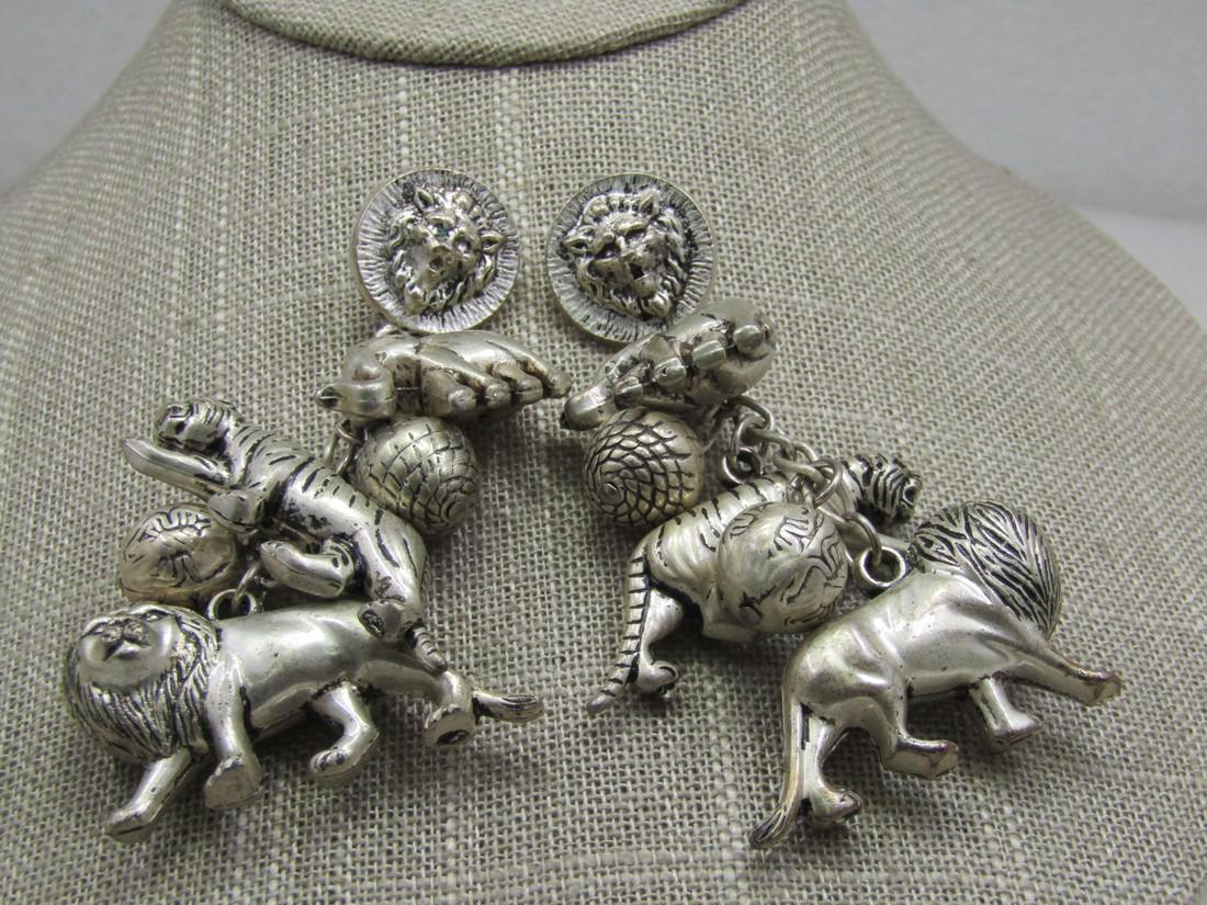 Vintage Lion, Tiger, Elephant Charm Earrings, Pierced: Vintage Lion, Tiger, Elephant Charm Earrings, Pierced, 3", Silver tone with black wash , plsatic that looks like metal. The animals, especially the tiger and lion are appx. 1.5" long and 3/4" tall and