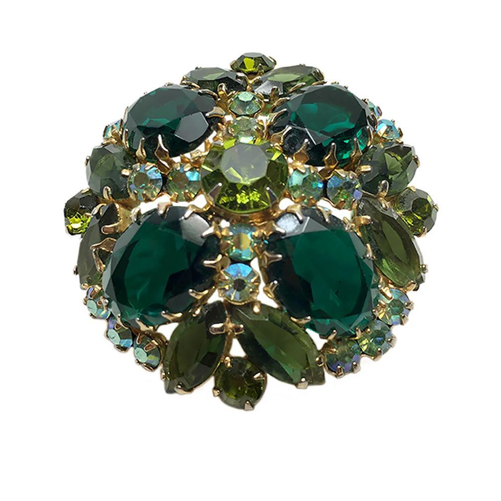 D&E Juliana Emerald Multi Pronged Brooch: This is a 1963 DeLizza & Elster Juliana dome brooch with large emerald glass stones, accented with green and ab chatons. It features gold tone metal multi prong setting. Please see page 102 Juliana Je