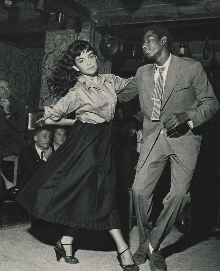 ROBERT DOISNEAU-Claude Mocquery & James Campbell, Vieux: Artist: ROBERT DOISNEAU - Print Title: Claude Mocquery & James Campbell, Vieux Colombier Printing Date: 1950s Medium: Authentic Vintage Sheet-fed photogravure Printed in: France Image Size approx.: 8.