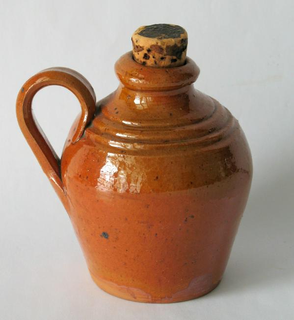 Antique miniature redware belly jug.: Title: Antique miniature redware belly jug. Date/Period: 1840's Dimension: 4 1/4" high Additional Information: Very rare antique Lancaster County Pennsylvania redware belly jug in a great red glaze an