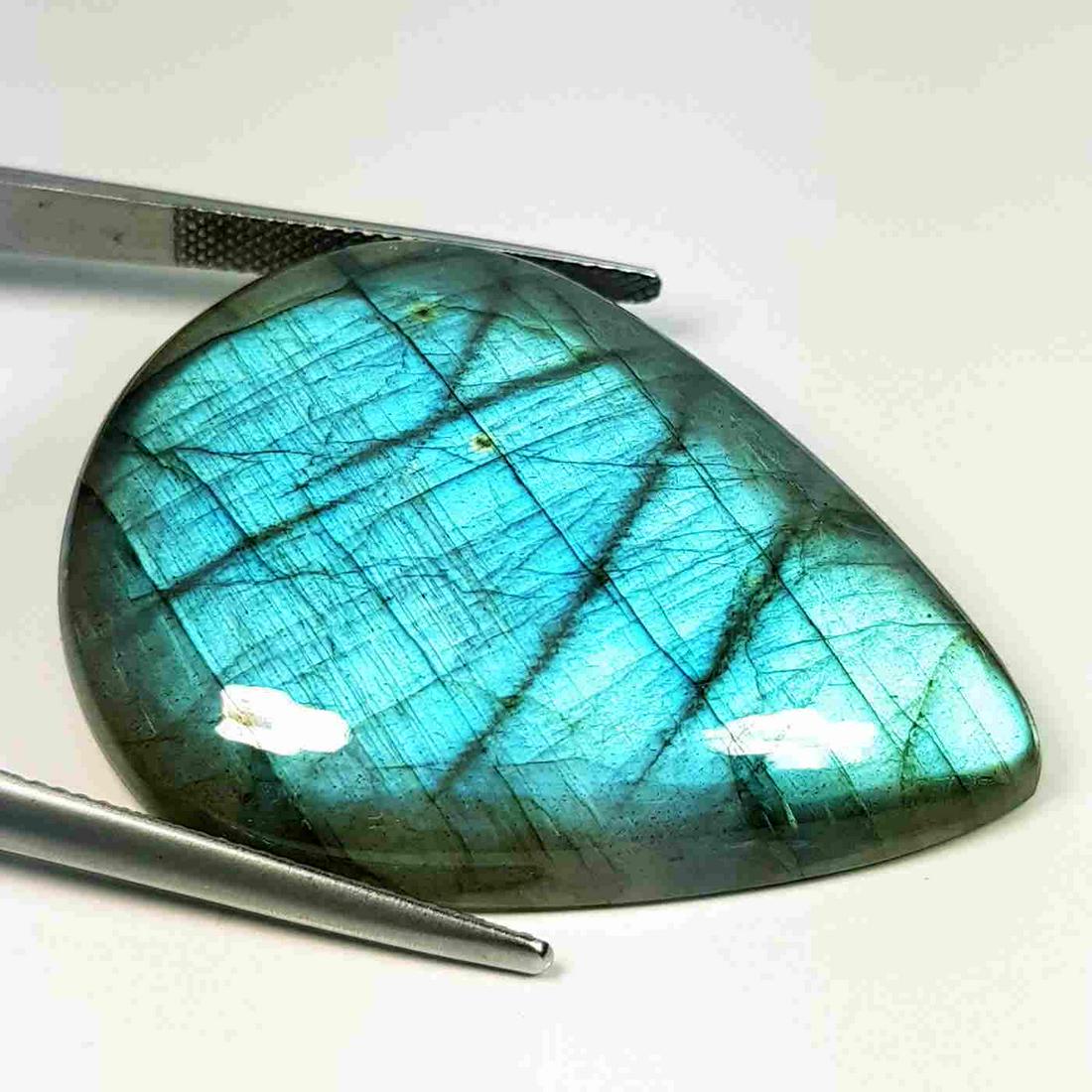 72.88 ct Natural Labradorite: No Reserve! Title: 72.88 ct Natural Labradorite Color/Clarity: Opaque Carat Weight: 72.88 Size/Dimensions: 41.20 x 30.60 x 7.70 Additional Information: Pear - USA Shipping: Domestic: Flat-rate of $7.