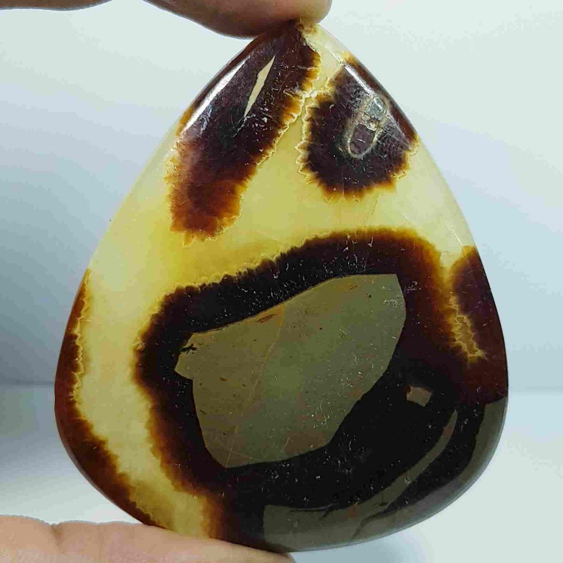 161.21 Ct Natural Jasper: No Reserve! Title: 161.21 Ct Natural Jasper Color/Clarity: Opaque Carat Weight: 161.21 Size/Dimensions: 66.66 x 56.35 x 5.35 Additional Information: Pear - Africa Shipping: Domestic: Flat-rate of $7.