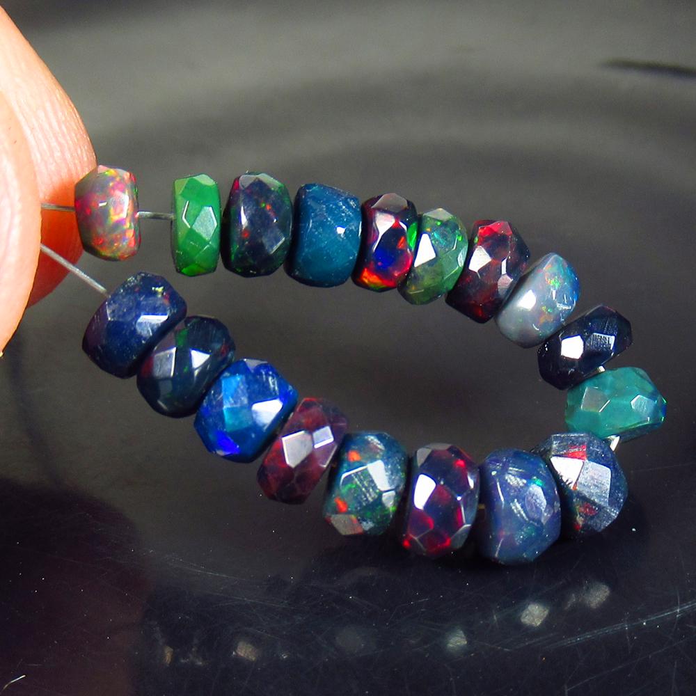 5.71 Ct Natural 18 Drilled Black Faceted Fire Opal: No Reserve! Title: 5.71 Ct Natural 18 Drilled Black Faceted Fire Opal Beads Color/Clarity: Translucent Gemstone: Natural Faceted BlackOpal Beads Carat Weight: 5.71 Size/Dimensions: 4.10 to 5.10 mm / 1