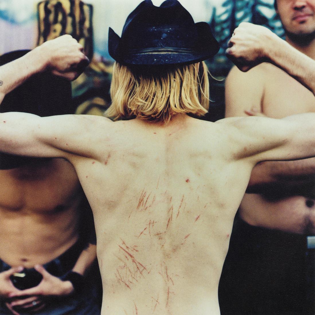 ANTON CORBIJN - Kurt's Back: Artist: Anton Corbijn Title: Kurt's Back Medium: Photo Litho, 1996, Italy Dimensions: 9.6x9.6" Description: Heat Wax Mounted on 11x14" Conservation Board Artist Bio: Anton Johannes Gerrit Corbijn van