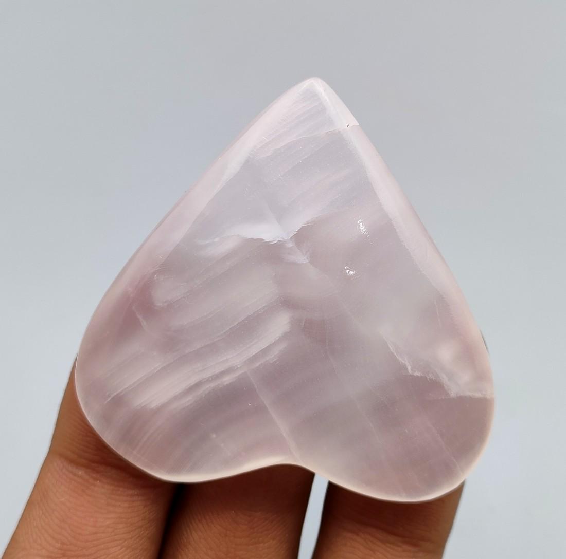 153 Carat Hand Made Pink Calcite Mineral Heart: Title: 153 Carat Hand Made Pink Calcite Mineral Heart Treatment: Natural Carat Weights:153 Carat Size/Dimensions: 48x48x8 mm Origin: Pakistan Reserve: $15.00 Shipping: Domestic: Flat-rate of $15.00 to