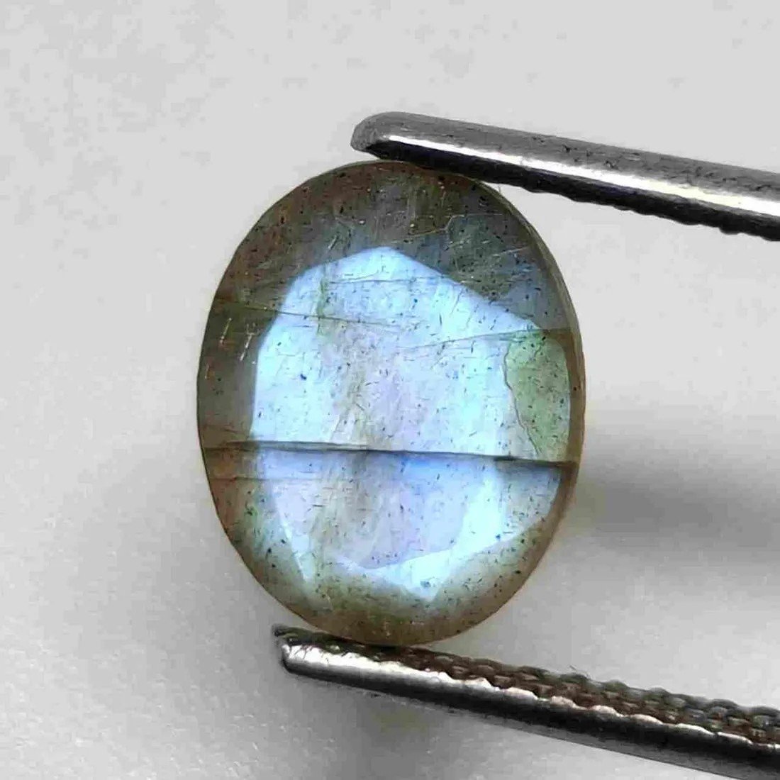 2 ct Natural Faceted Labradorite: No Reserve! Gemstones: Labradorite Carat Weights: 2 ct Size/Dimensions: 9 X 7 mm Origin : Labrador Shipping: Domestic: Flat-rate of $7.00 to anywhere within the contiguous U.S. International: Foreign