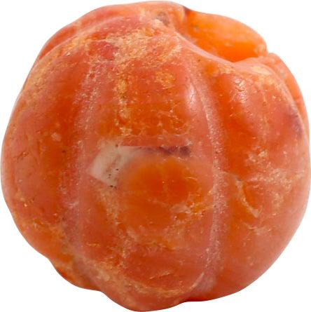 VIKING CARNELIAN BEAD, 900-1050 AD: Ribbed spherical, over 1/2" diameter (0.58"). Natural stone, shaped to a sphere and carved to melon form with six rounded ribs and one end recessed to mate with the next strung bead. Extremely labor-i