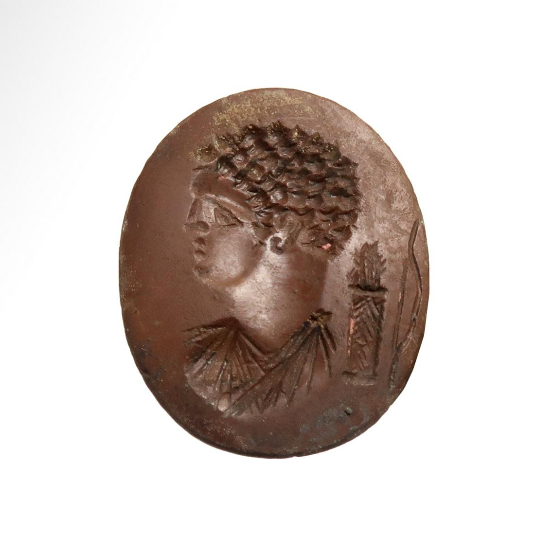 Roman Dark Red Jasper Intaglio with Bust of Apollo and: Title: Roman Dark Red Jasper Intaglio with Bust of Apollo and a Quiver Date & Origin: Roman, c. 1st Century A.D. Description: Finely carved with head of Apollo with curly hair, fine straight nose, ple