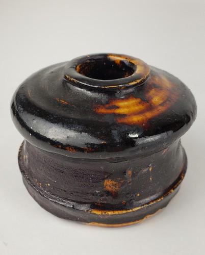 Redware Inkwell: Title: Redware Inkwell Date/Period: 19th c Dimension: 3" x 2 1/4" Material: red clay Additional Information: Redware inkwell in magnesium black glaze. Shipping: Domestic: Flat-rate of $12.00 to anywhe