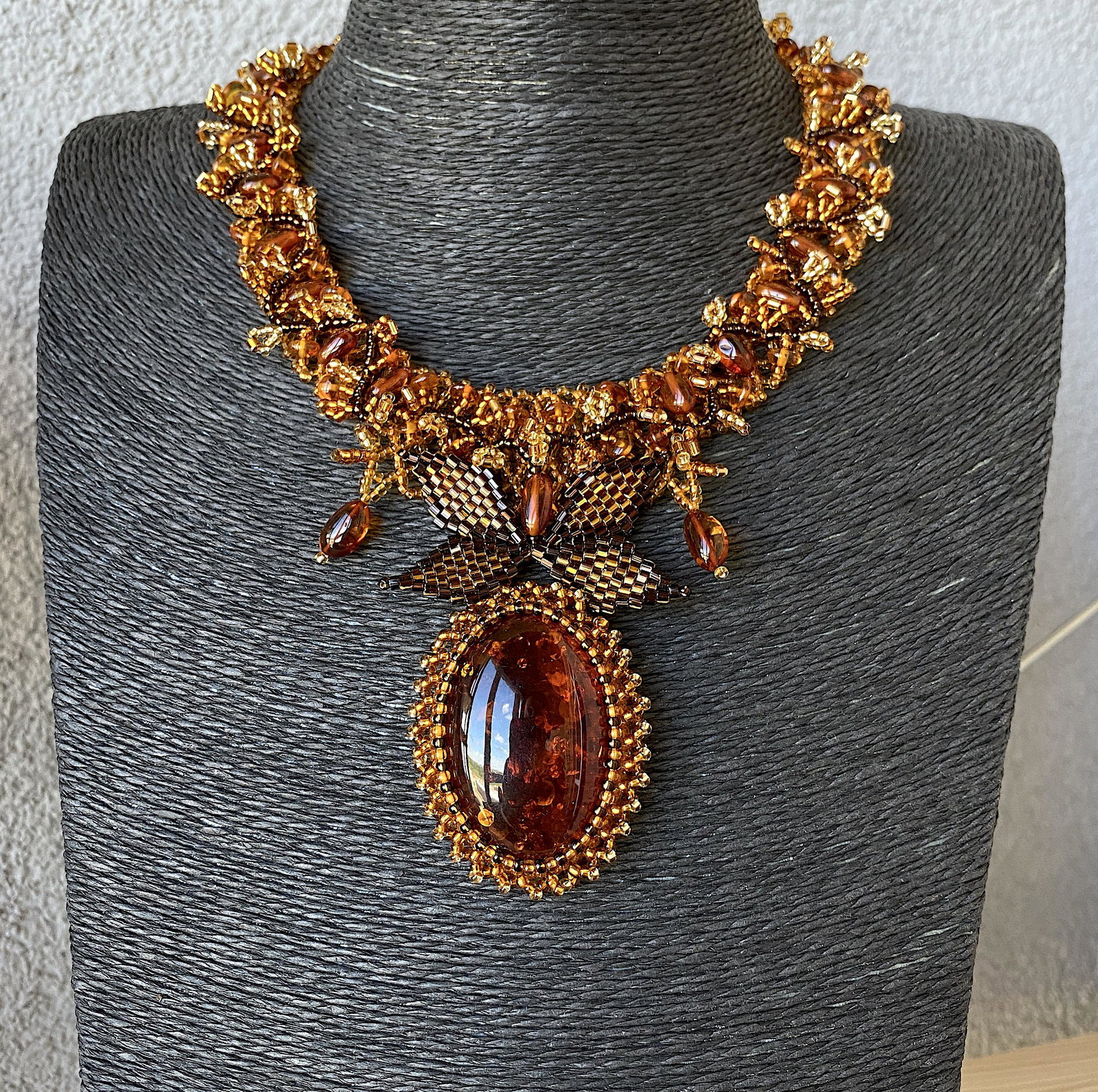 Remarkable Amber Floral Necklace made from leaf like: Title: Remarkable Amber Floral Necklace made from leaf like bead ornaments Metal: None Gemstones: Amber Weight: 54.5 g Size: Size: 440.0 x 90.0 x 10.0 mm Size: 17.323 x 3.543 x 0.394 inches Made of: W