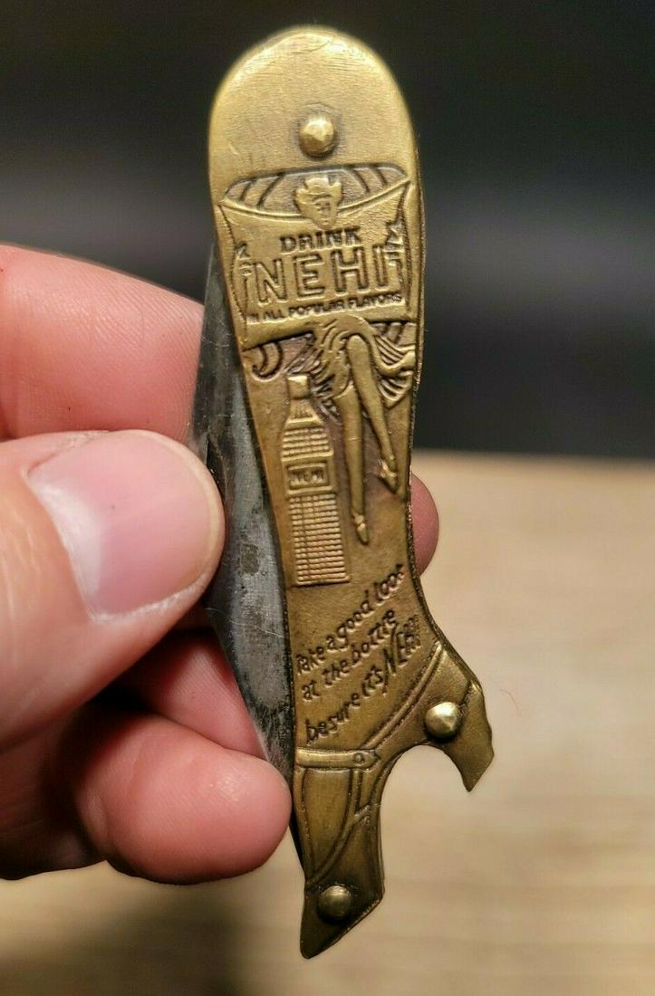 Nehi Boot Lady Leg Knife Bottle Opener: 3 1/4" Long closed, 5 3/8" long open x 3/4" wide Nice reproduction brass Nehi boot knife. The heel of the boot is a bottle opener. The knife opens with a pretty strong spring. Blade comes fairly sharp