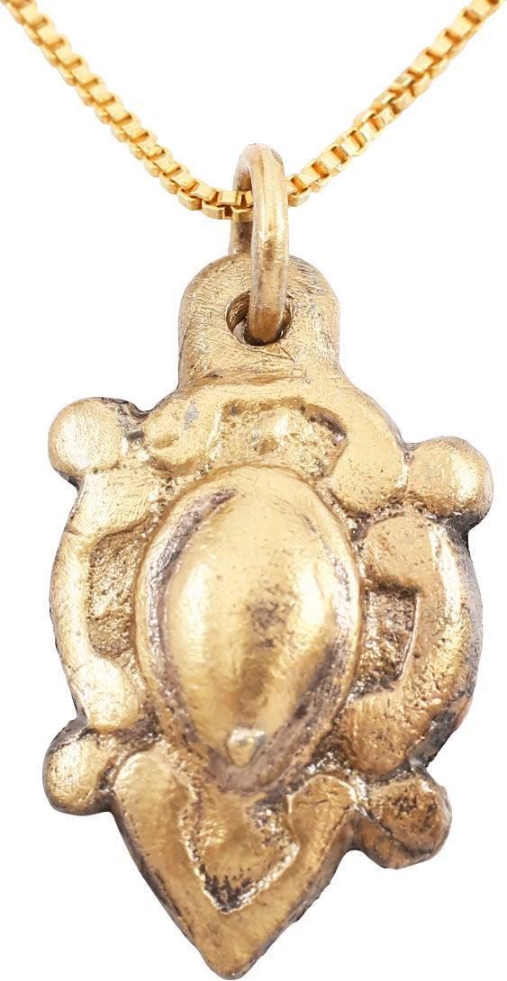 EXCEPTIONAL VIKING HEART PENDANT NECKLACE, 10TH-11TH C.: Over 7/8" height. Natural form heart of high domed section centered, with broad foliate edge and nubs at the quarter points describing a saltire. Well preserved with the intricate detail intact. The h