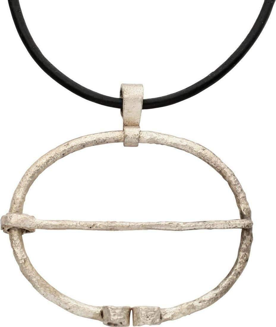VIKING PROTECTIVE BROOCH NECKLACE 850-1050 AD JEWELRY: Over 1 3/4" width, oval form with the ends curled. Original cross pin. Worn in numbers on the leather war jerkin, at an ounce each, a few pounds could be added providing significant protection against