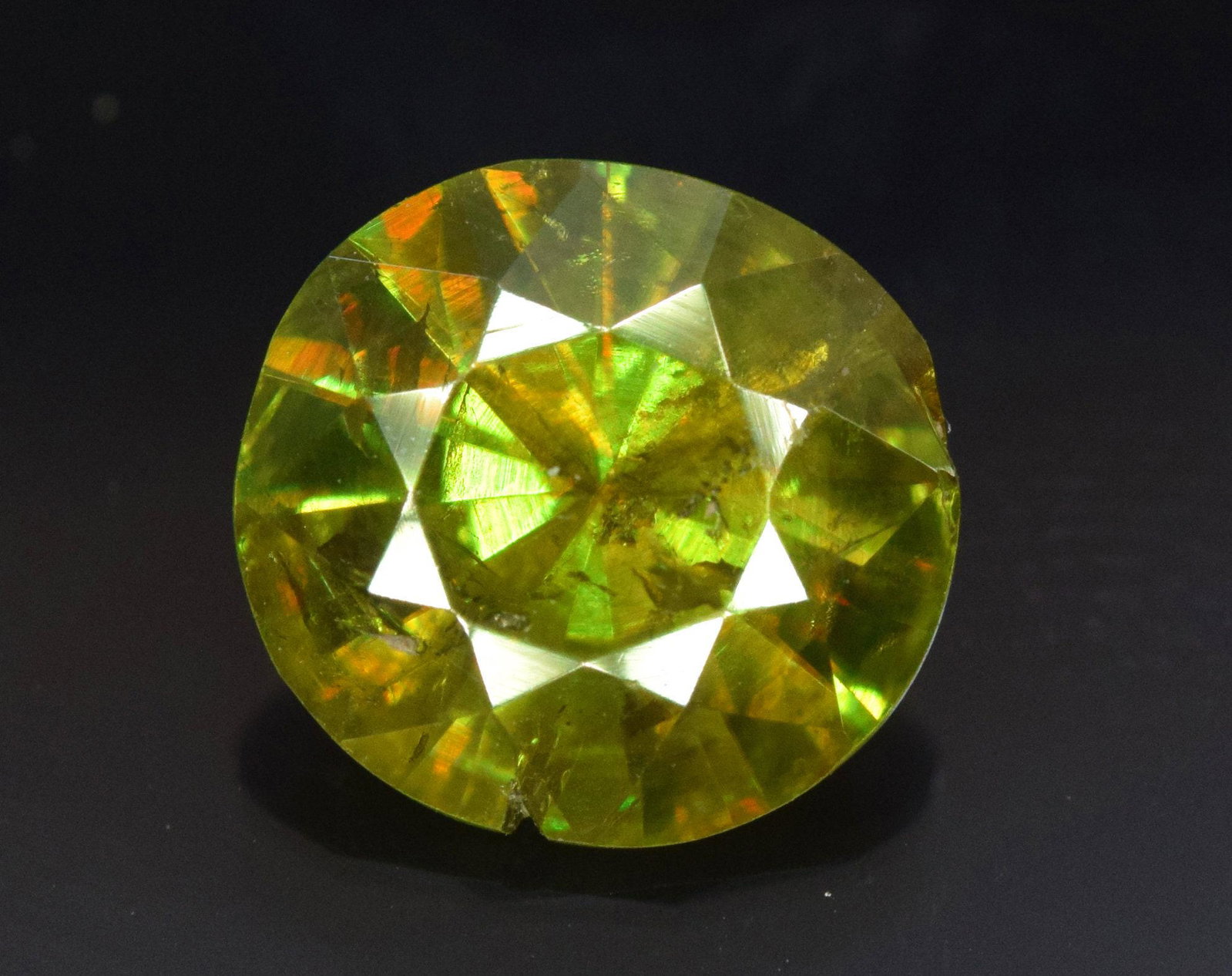 Sphene Full Fire Natural Loose Gemstone 1.35 Carats 774: Sphene Full Fire Natural Loose Gemstone - 1.35 Carats - 7*7*4 mm Weight : 1.35 Carats Size : 7*7*4 mm Origin : Pakistan Treatment : Natural Cut : Round Economy Shipping A1-56 Learn more about this ite
