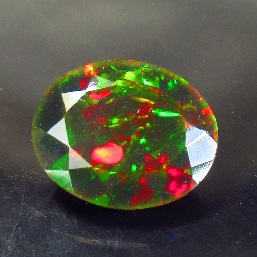 4.80 Ctw Natural Ethiopian Black Fire Opal Oval Cut: Title: 4.80 Ctw Natural Ethiopian Black Fire Opal Oval Cut Stone Clarity: Translucent Gemstones: Natural Black Opal Carat Weights: 4.8 Size/Dimensions: 14.10 x 11.50 x 7.50 mm Additional Information: 