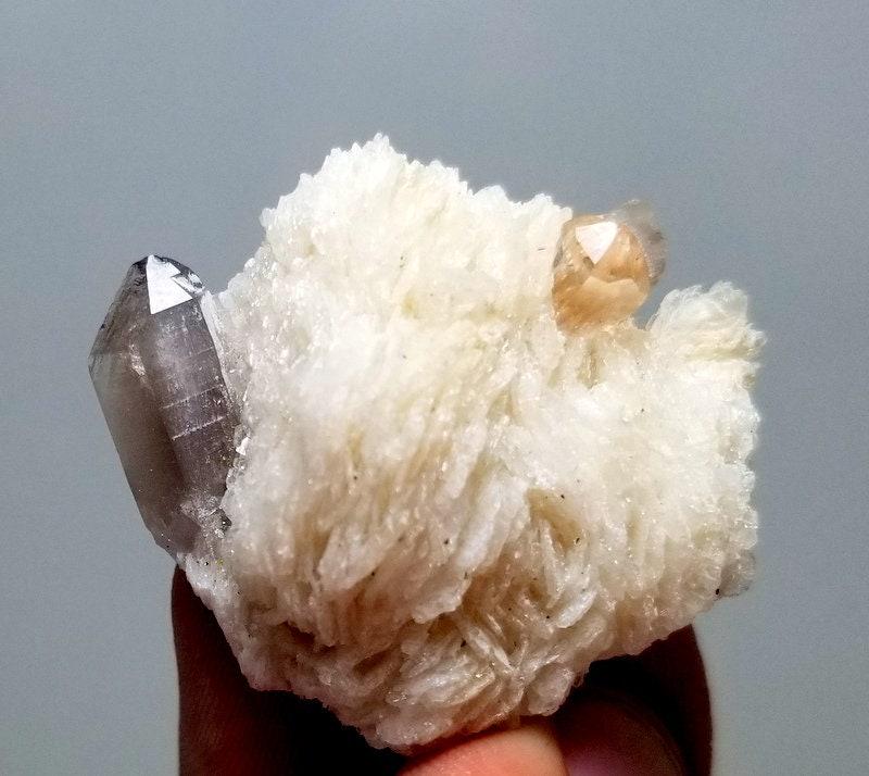 23 Grams Very Beautiful Topaz Crystal With Quartz And: 23 Grams Very Beautiful Topaz Crystal With Quartz And Albite Specimen From Skardu pakistan size 17mm 33mm 35mm weight 23 Grams Reserve: $15.00 Shipping: Domestic: Flat-rate of $10.00 to anywhere withi
