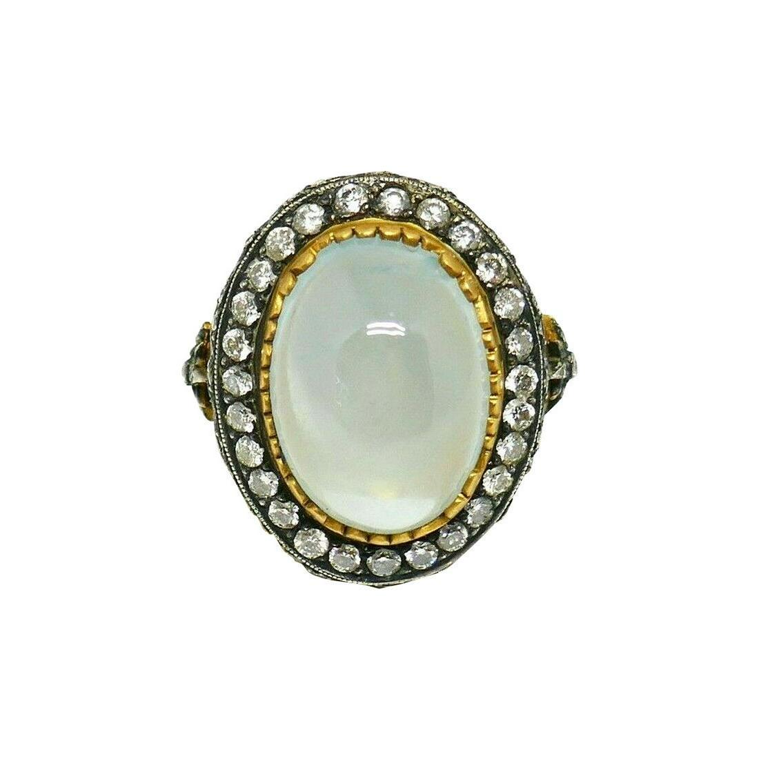 Stephen Webster Opal Yellow Gold Sterling Silver: Description: Gorgeous opal ring by Stephen Webster made of 18k yellow gold featuring sterling silver decorative elements. Gold has a matte finish. Ring size is 6 (sizable). Stamped with the Stephen We