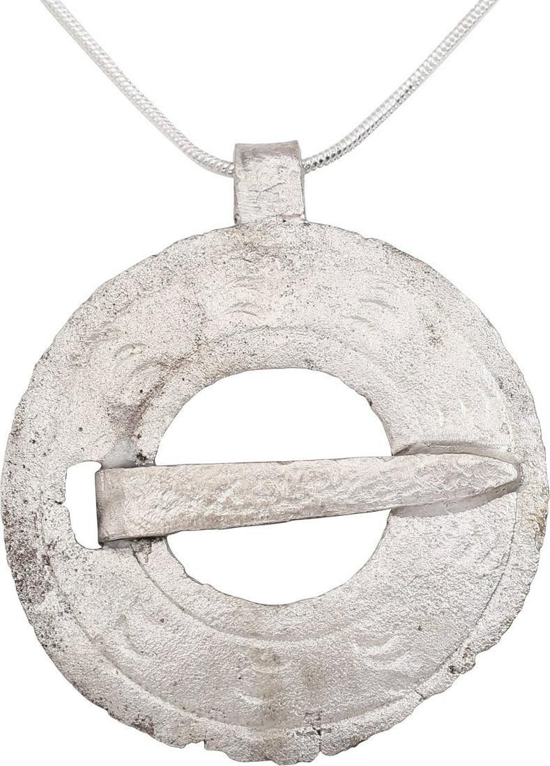 FINE VIKING PROTECTIVE BROOCH PENDANT NECKLACE: Circular bronze, over 1 1/2" diameter. Circular, slotted for the cross pin. Slightly domed and line bordered with eight radial groups of three crescents, a reference to the moon worshiped as Mani, and
