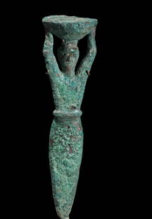 Mesopotamian Bronze foundation figure carrying a: Title: Mesopotamian Bronze foundation figure carrying a basket, Circa 2000 BCDescription: Foundation figures were ritualistic works of art that were used in the construction of ancient Mesopotamian