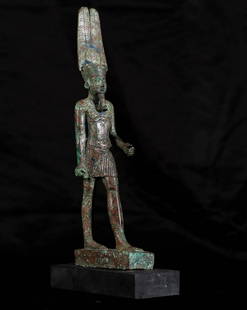 Ancient Egypt Bronze figure of Amun-Re, 26th Dynasty: Title: Ancient Egypt Bronze figure of Amun-Re, 26th Dynasty (595-589 BC) - Reign of Psamtik IIDescription: The god is standing in a frontal position with his left leg forward in a marching attitude.