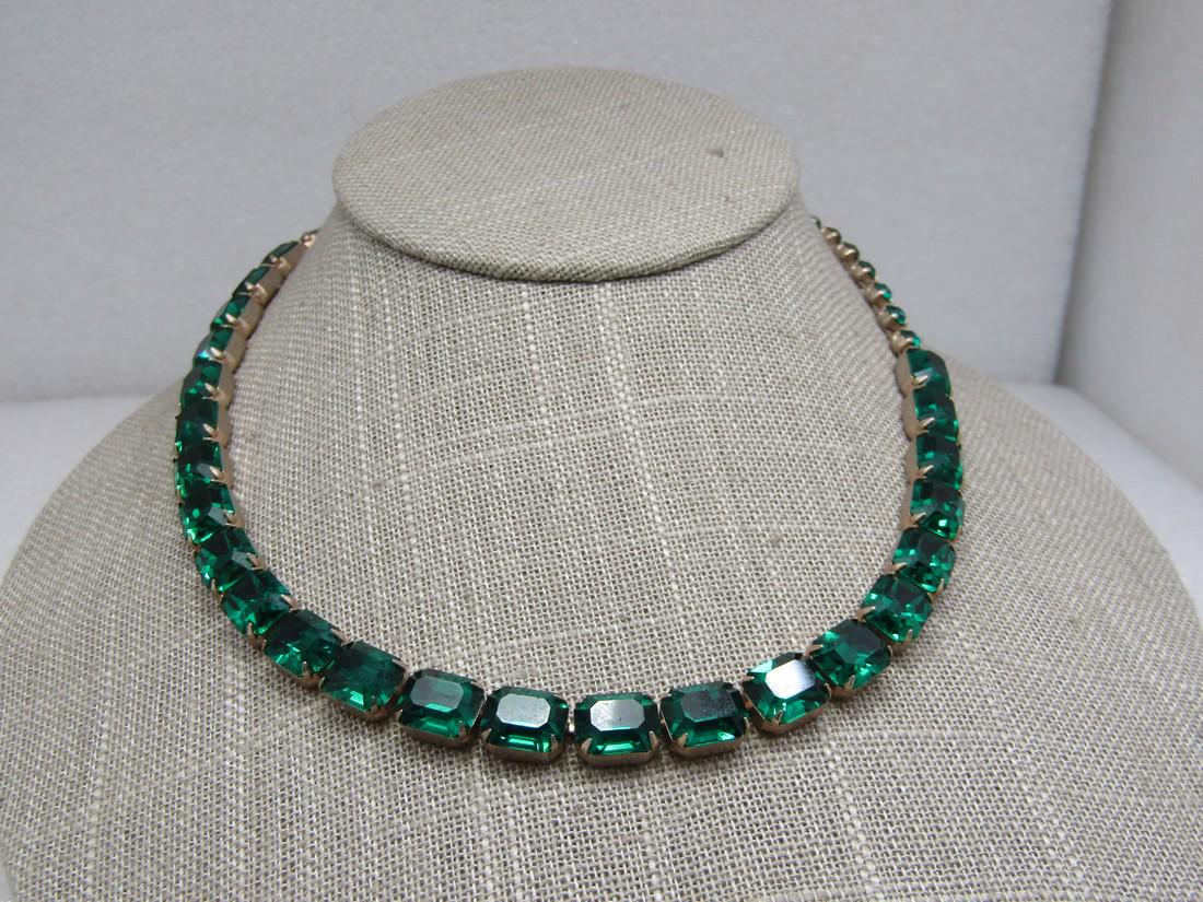 Vintage Green Rhinestone Necklace, Emerald Cut, 17": Vintage Green Rhinestone Necklace, Emerald Cut, 17" . The emerald cut rhinestones are appx. 9.5mm by 8mm, prong-get in closed back settings with round stones in the necklace at both ends. One stone ha