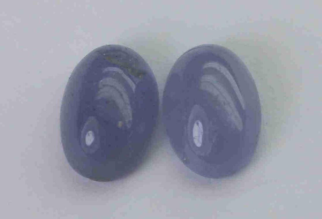 1.69 cts Natural Tanzanite Lot: No Reserve! Gemstone : Natural Tanzanite Shape and cut : Oval cabochan Weight : 1.69 Carats Measurements : 6.5x4.5 mm Number of Stone : 2 Color : voilite Transprancy : Transparent Treatment : No Treat
