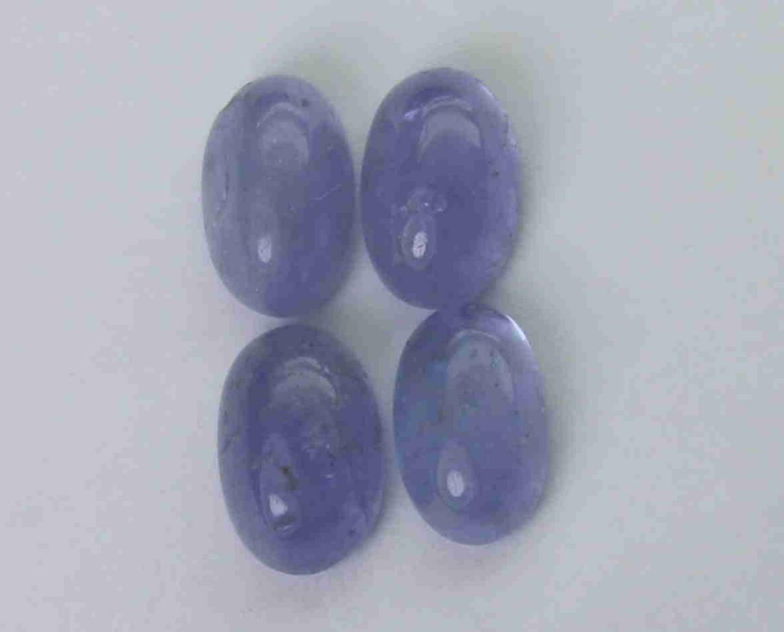 2.20 cts Natural Tanzanite Lot: No Reserve! Gemstone : Natural Tanzanite Shape and cut : Oval cabochan Weight : 2.20 Carats Measurements : 5.96x3.91x2.76 mm - 5.76x3.58x2.37 mm Number of Stone : 4 Color : voilite Transprancy : Trans